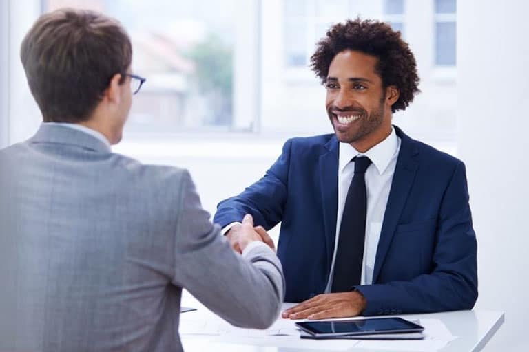 Interviewer and interviewee shaking hands