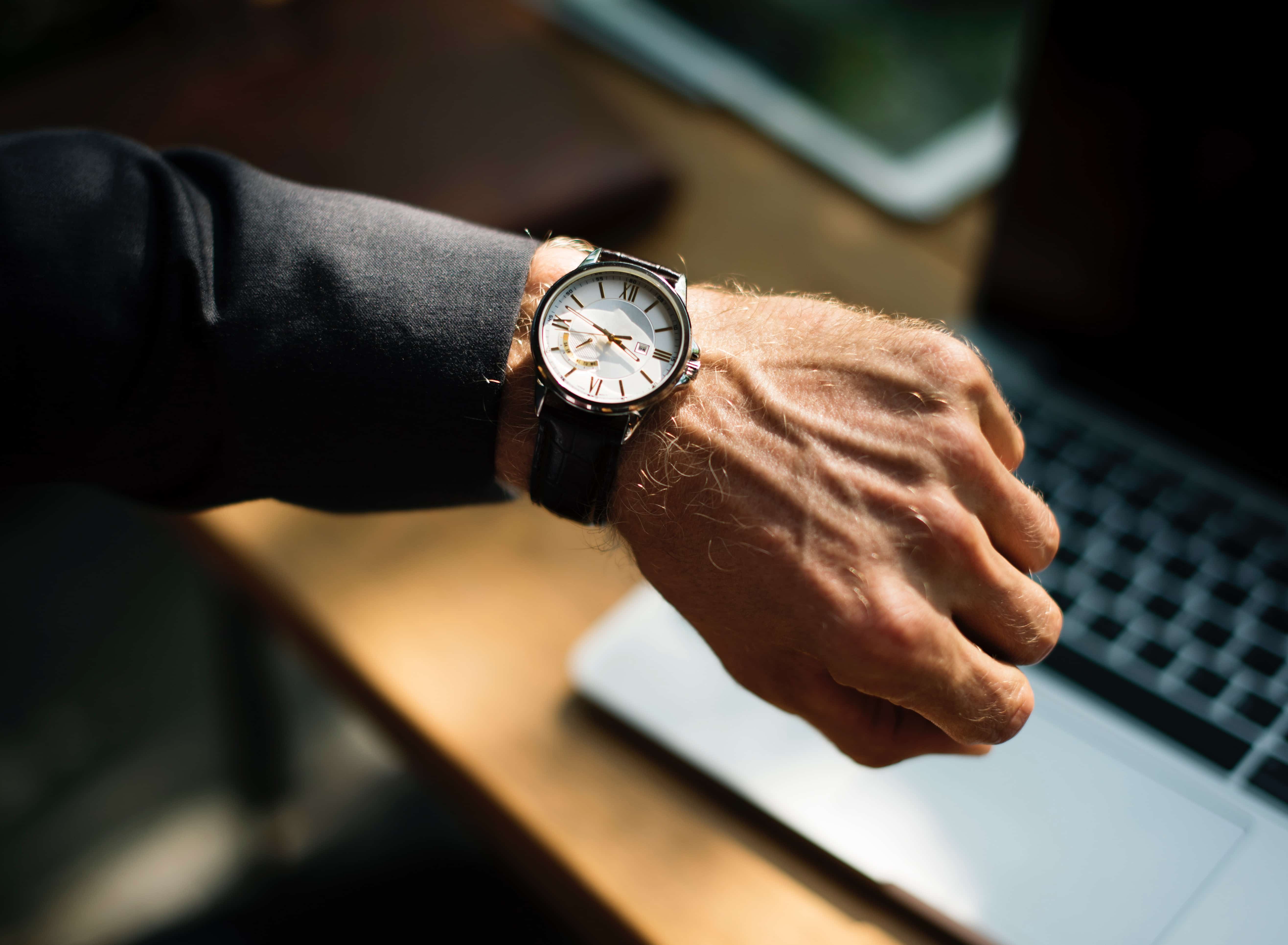 wrist watch worn by a corporate man
